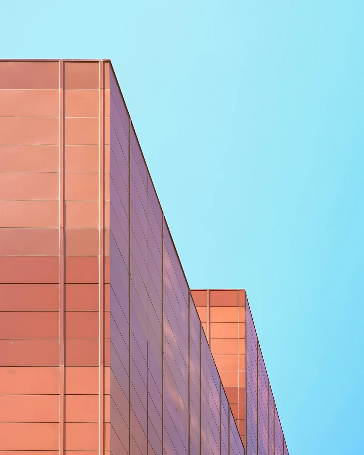 Metal panel facade of an industrial building in late light