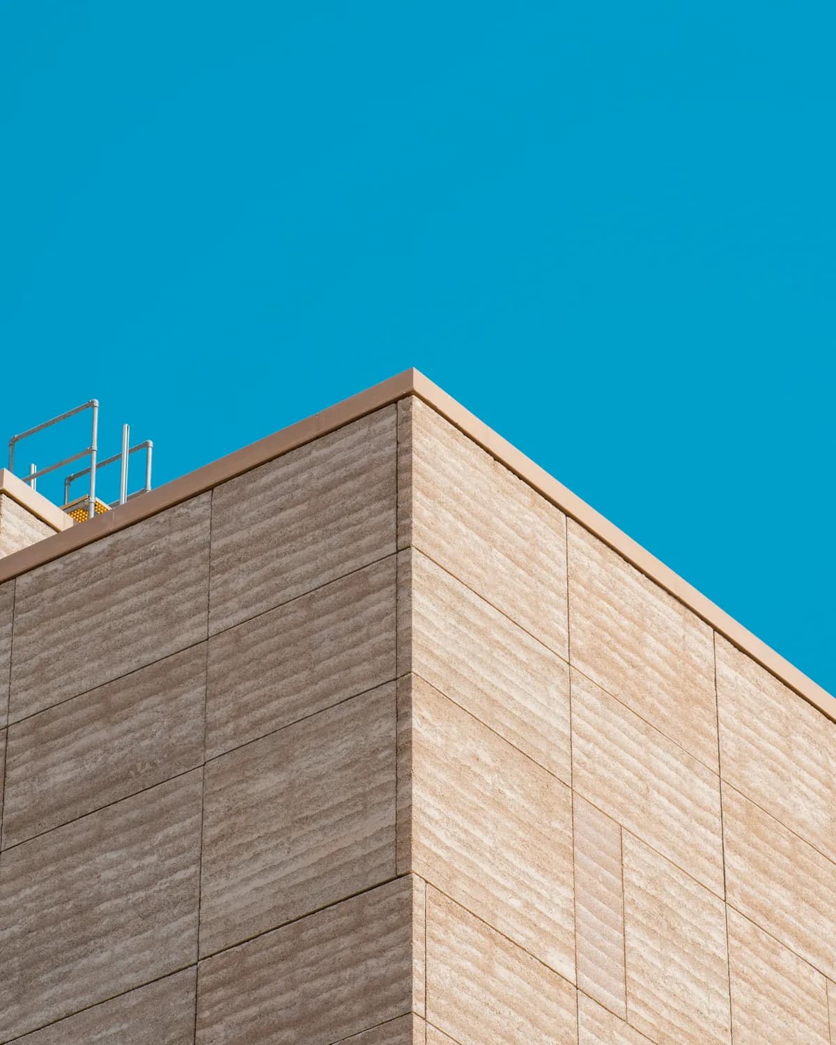 Precast panel corner of an industrial building against open sky